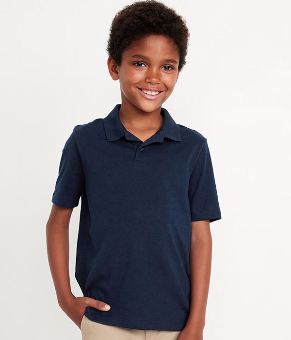 Child wearing a navy blue polo shirt