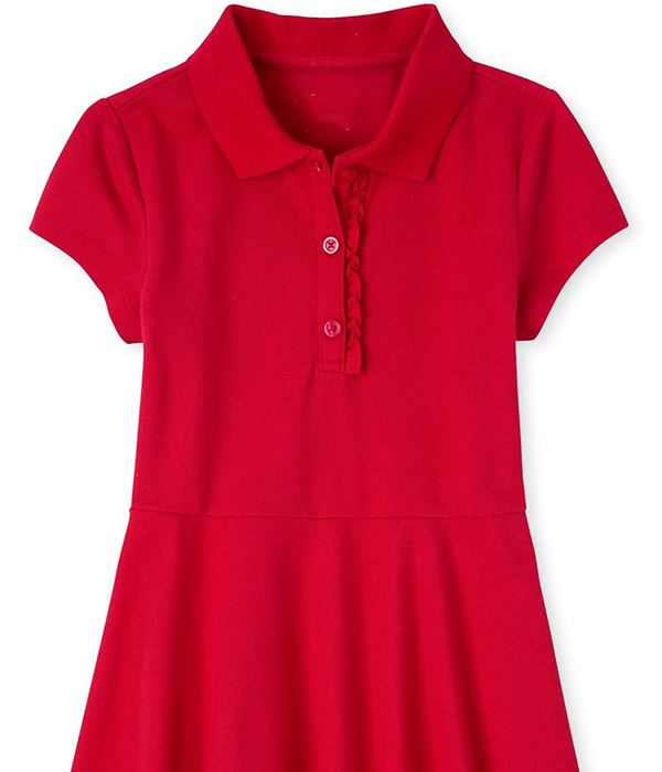 Child wearing a white polo shirt