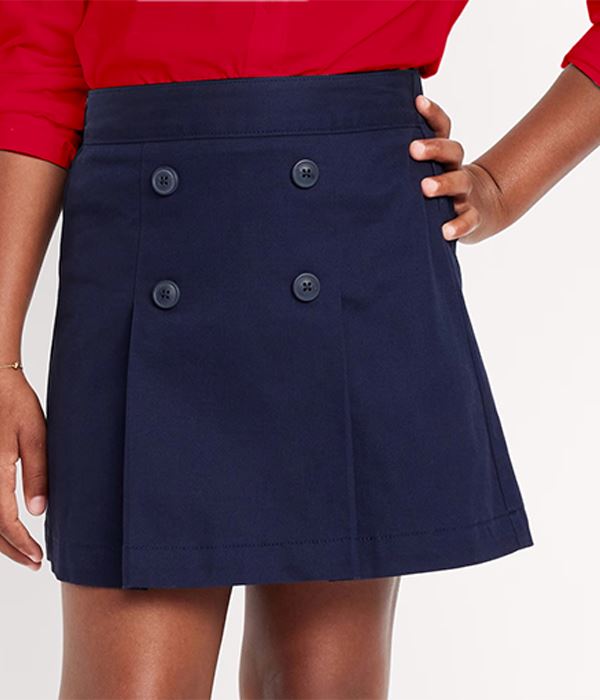 Child wearing a navy blue polo shirt