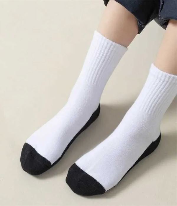 Child wearing a navy blue polo shirt