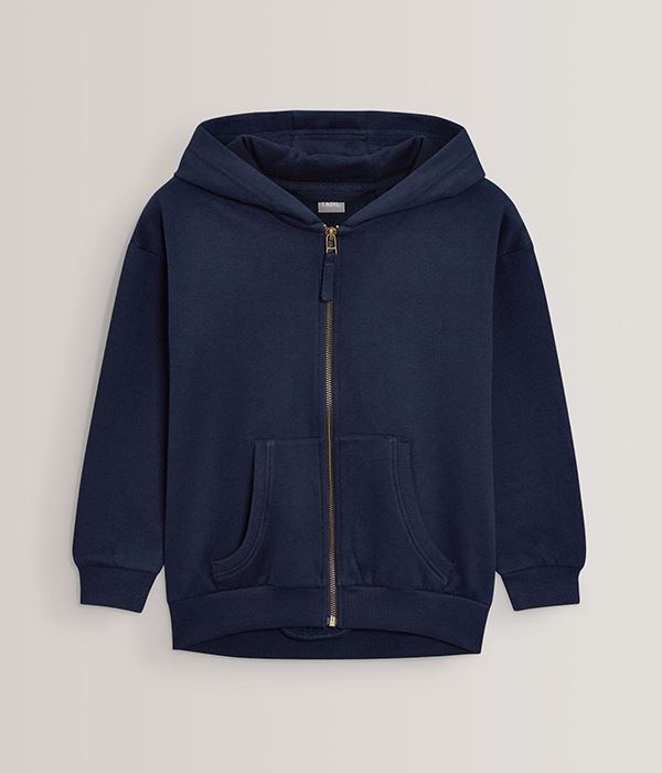 Child wearing a navy blue polo shirt