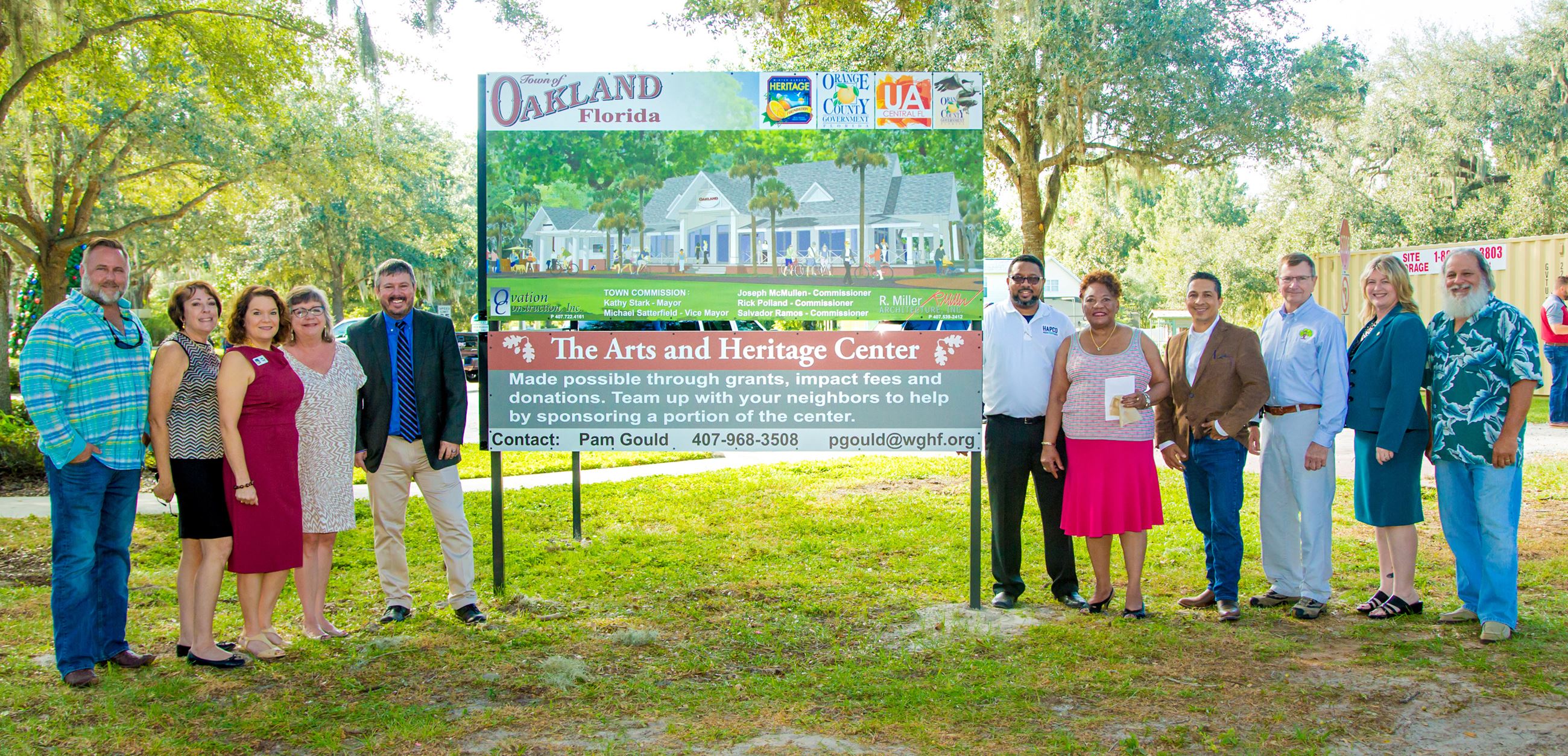 Local and State officials around The Arts and Heritage Center sign Local and State officials around The Arts and Heritage Center sign